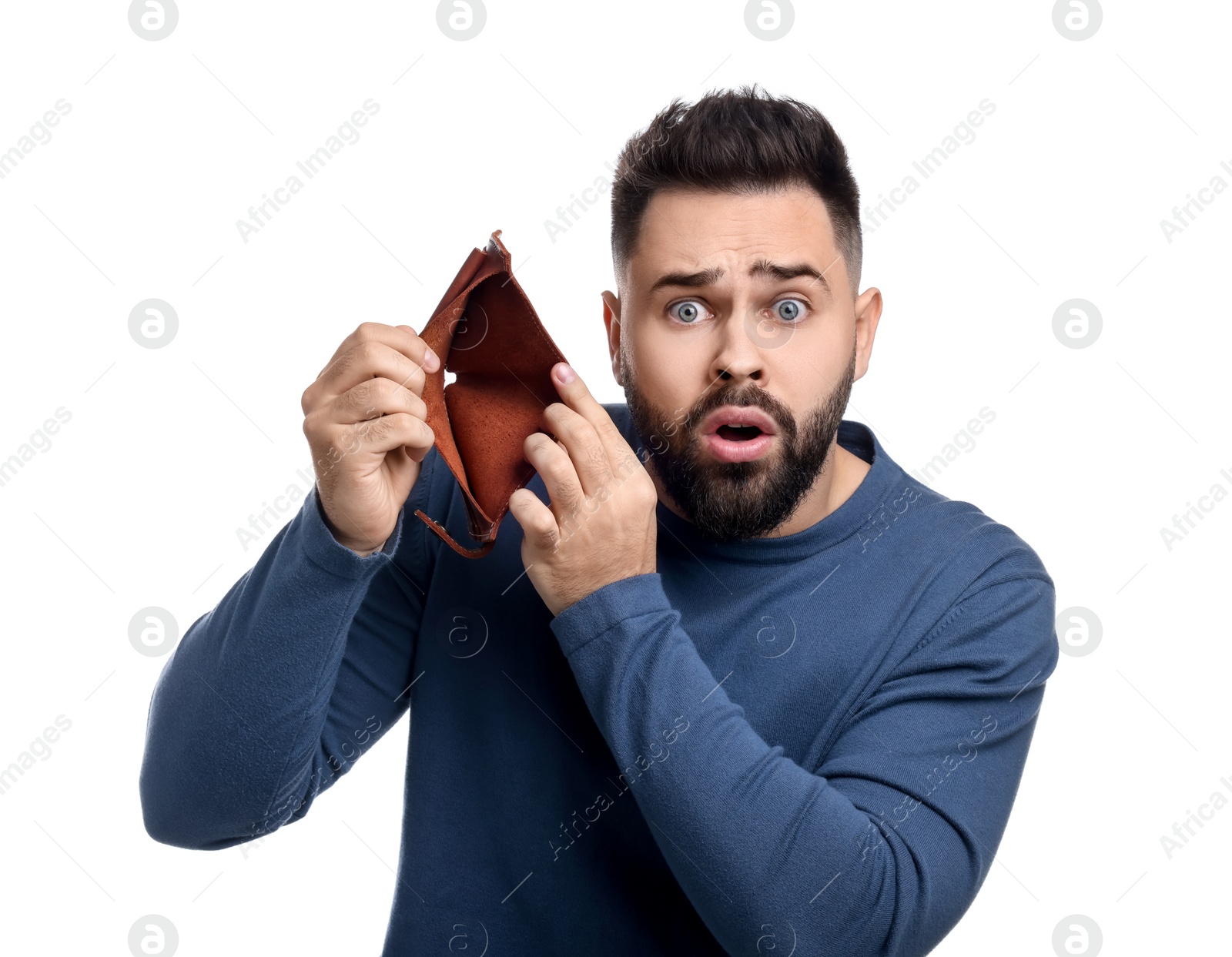 Photo of Confused man showing empty wallet on white background