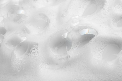 Photo of Soap foam with bubbles as background, closeup