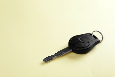 Car key on color background. Space for text