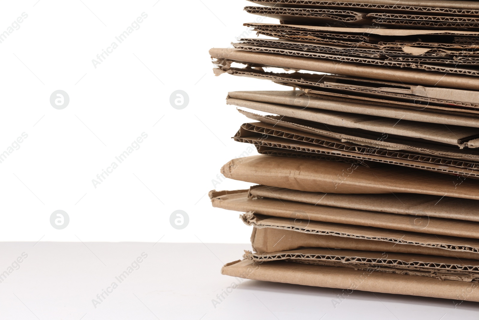 Photo of Stack of cardboard pieces isolated on white