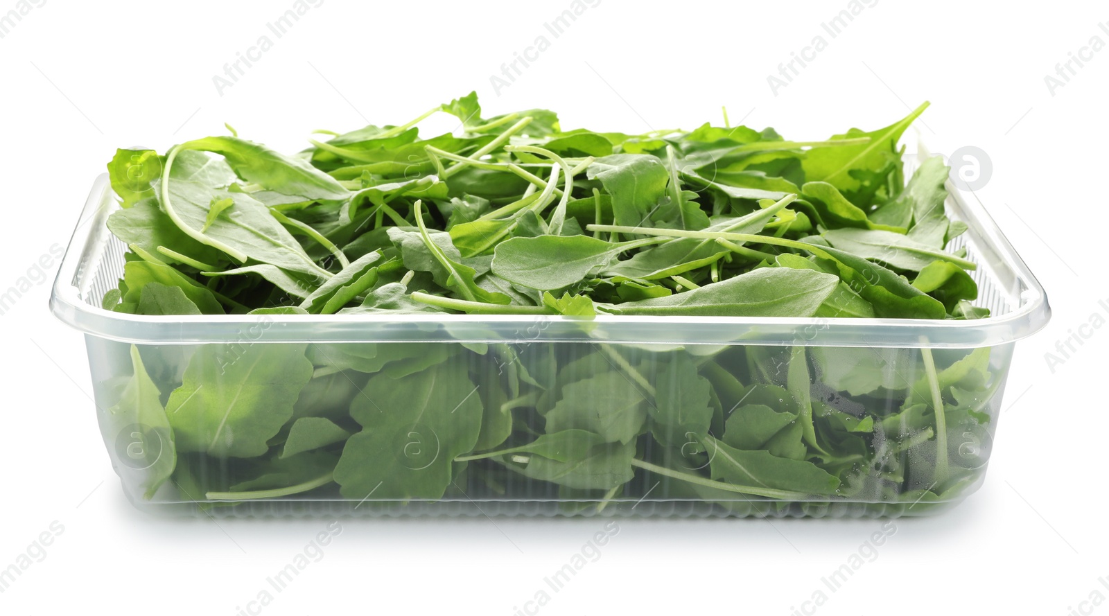 Photo of Fresh arugula in plastic container isolated on white