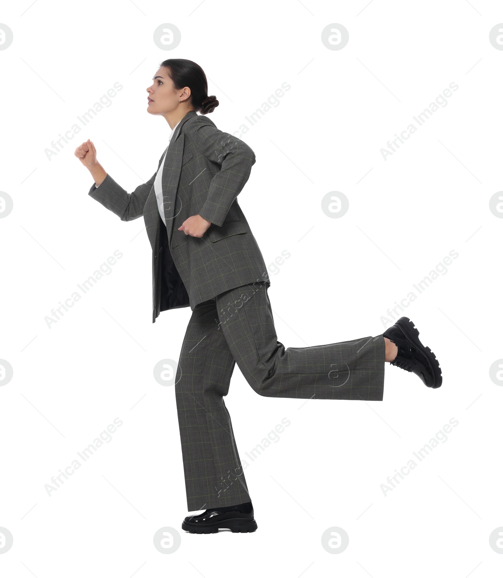 Photo of Beautiful young businesswoman running on white background