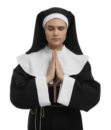 Nun with clasped hands praying to God on white background