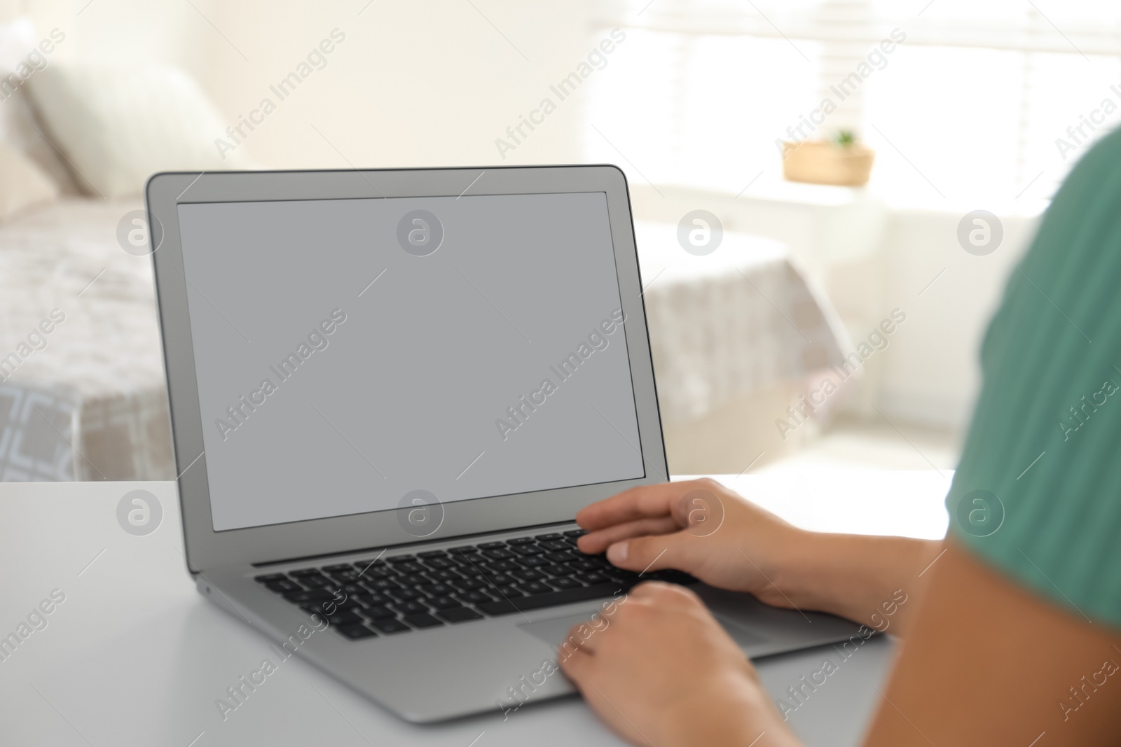 Photo of Coworkers working together online. Young woman using video chat on laptop, closeup