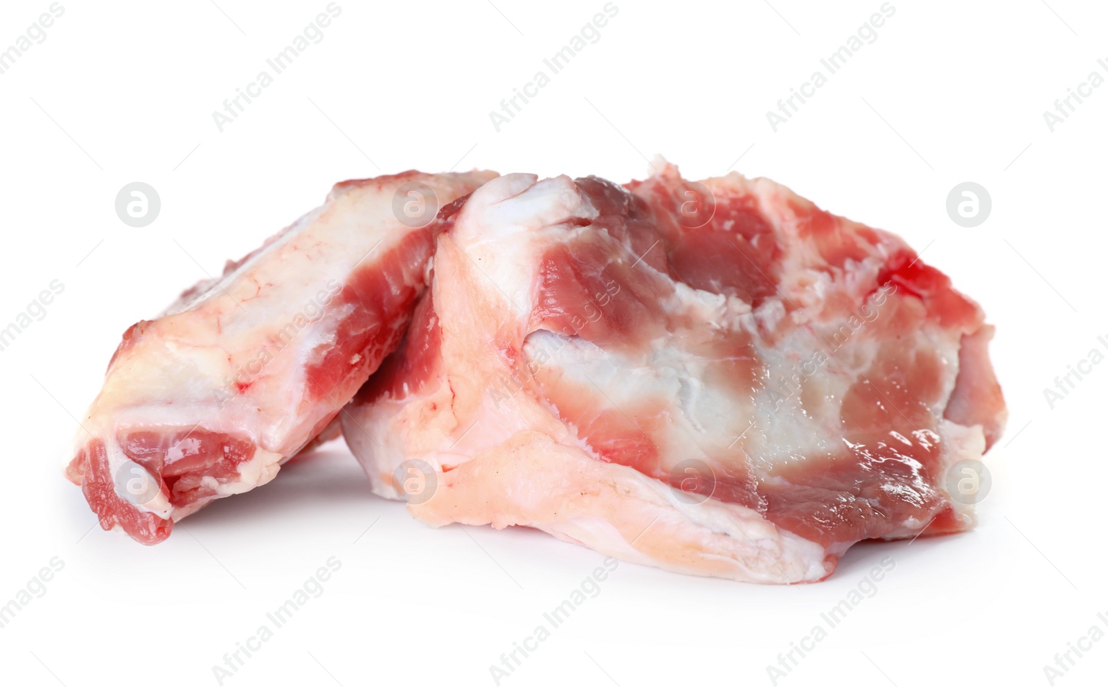 Photo of Raw chopped meaty bones on white background