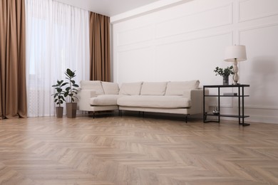 Modern living room with parquet flooring and stylish furniture