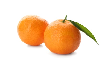 Photo of Whole fresh tangerines with green leaf on white background