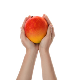 Woman holding ripe exotic mango on white background, closeup