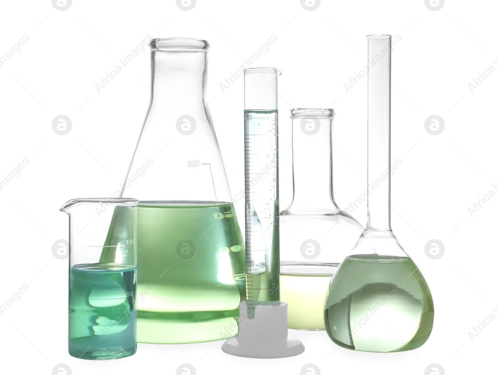 Photo of Glassware with liquids isolated on white. Laboratory analysis