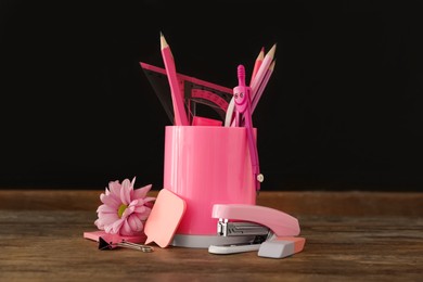 Photo of Set of stationery and flower on wooden table near chalkboard. Teacher's Day