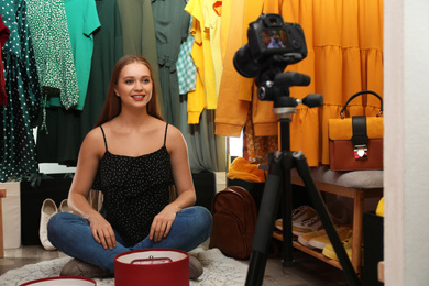 Fashion blogger recording new video in dressing room