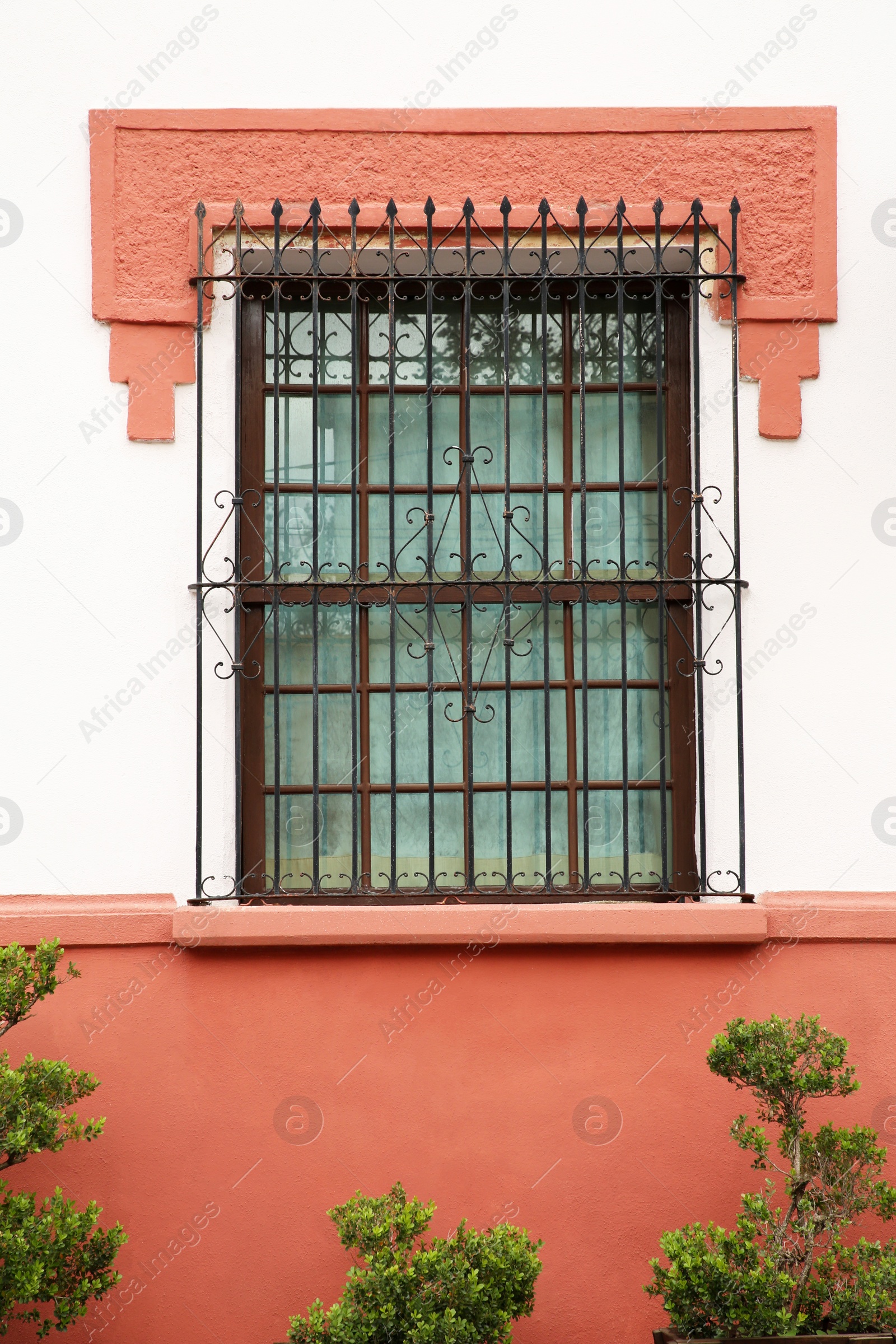 Photo of Building with beautiful window and steel grilles