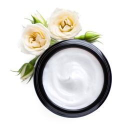 Jar of hand cream and roses on white background, top view