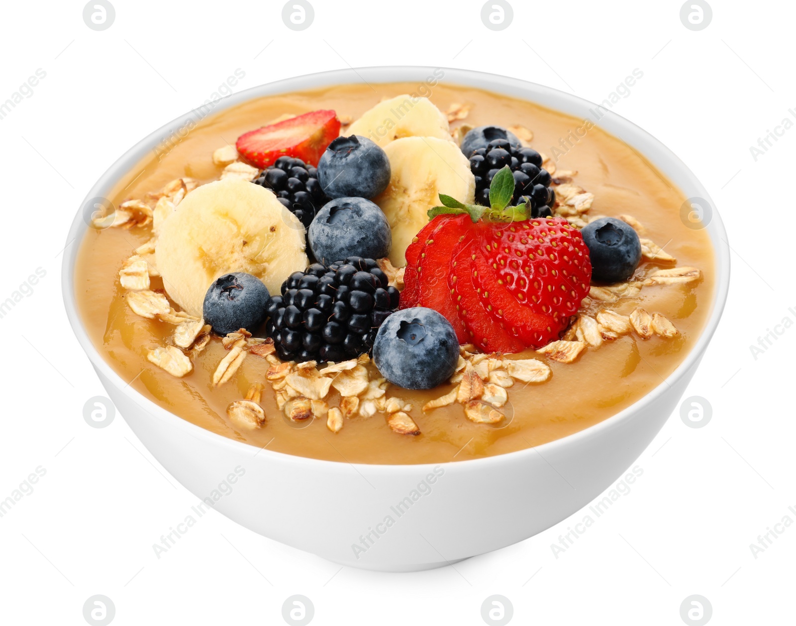 Photo of Delicious smoothie bowl with fresh berries, banana and oatmeal on white background
