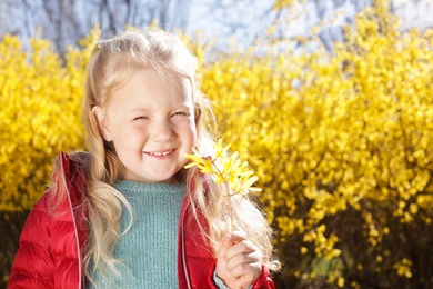 Photo of Happy healthy little girl enjoying springtime outdoors, space for text. Allergy free concept