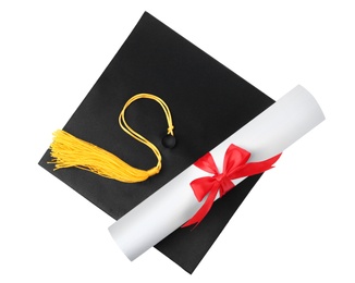 Photo of Graduation hat with gold tassel and diploma isolated on white, top view