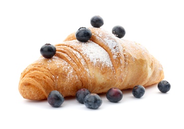 Tasty croissant with berries and sugar powder on white background