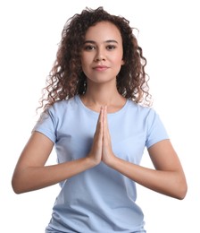 Photo of Beautiful African-American woman meditating on white background