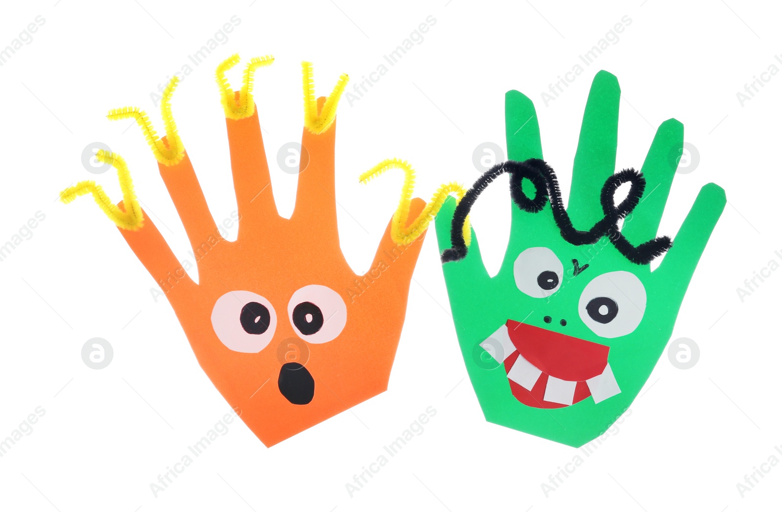 Photo of Funny hand shaped monsters on white background, top view. Halloween decoration