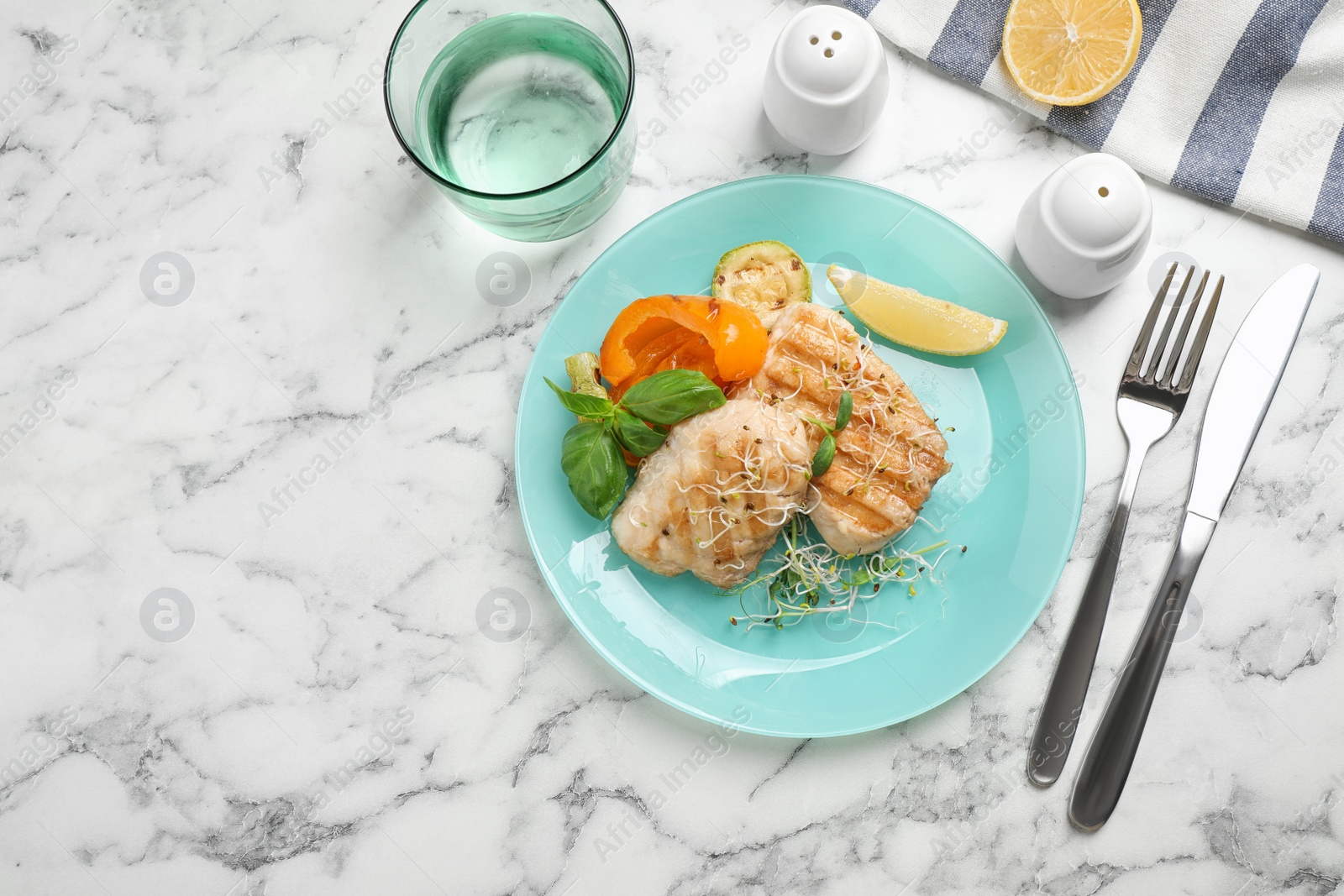 Photo of Flat lay composition with grilled fish on marble table