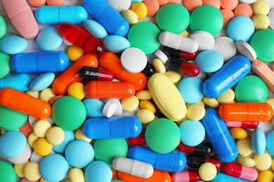 Photo of Many colorful pills as background