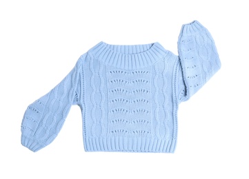 Photo of Light blue knitted sweater on white background, top view