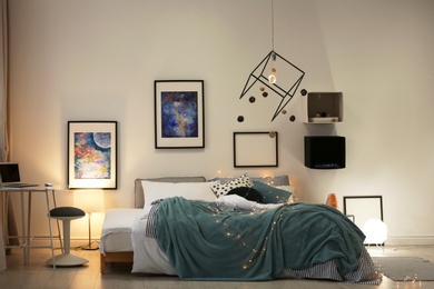 Photo of Stylish room interior with comfortable bed and decor