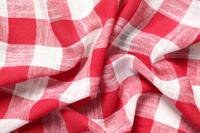 Texture of crumpled checkered fabric as background, top view