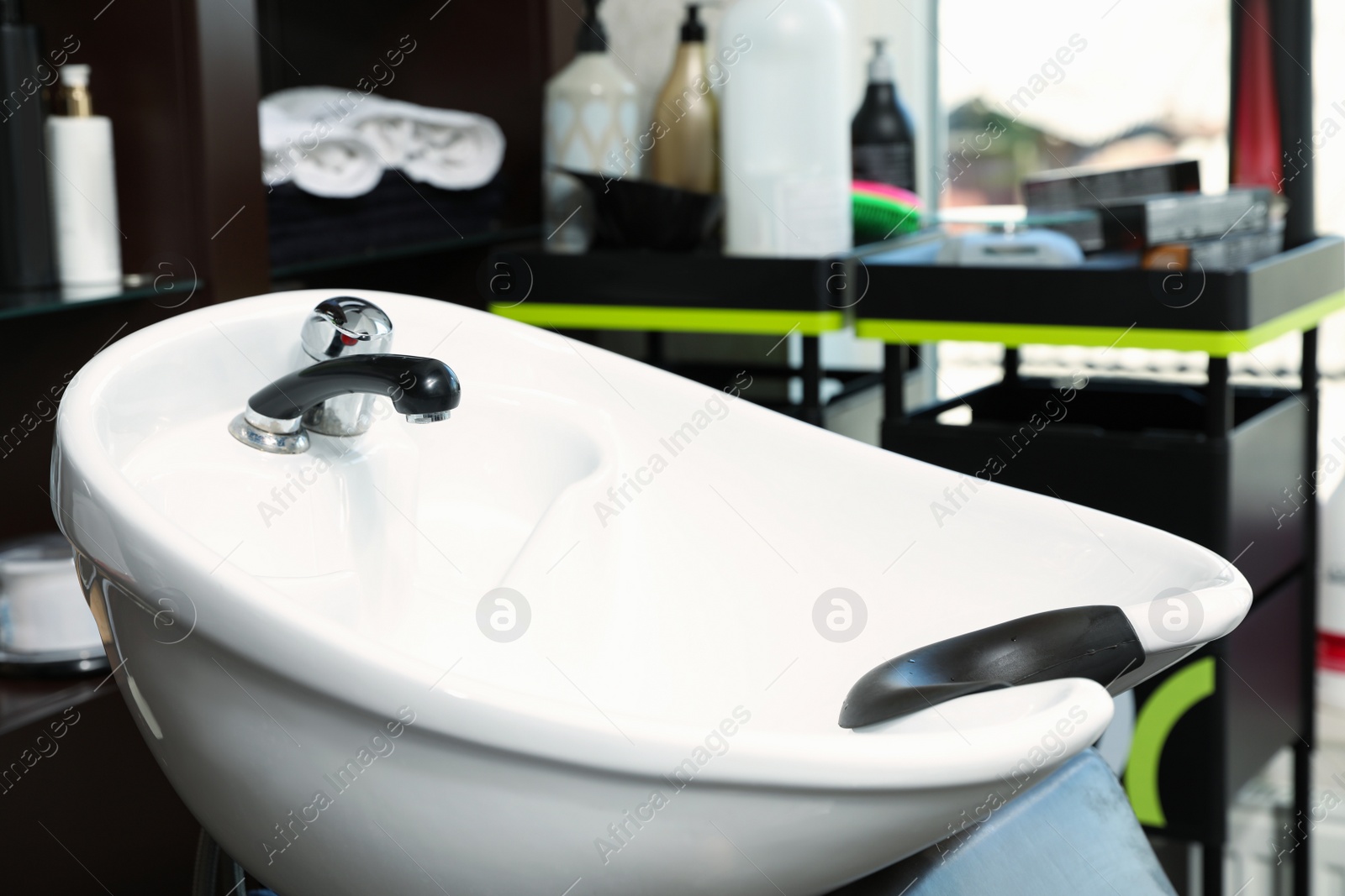 Photo of Hair washing sink in modern beauty salon