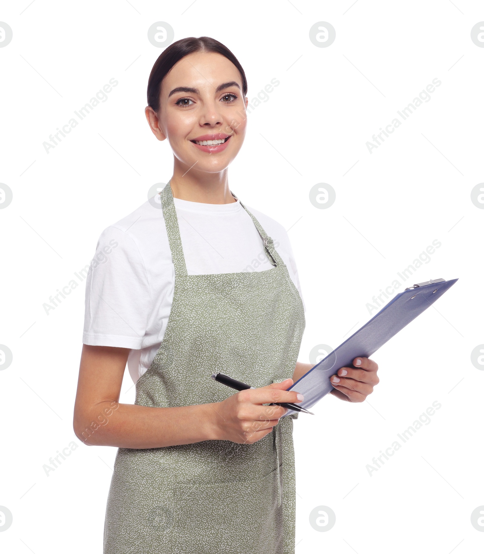 Photo of Young woman in light green apron with clipboard on white background