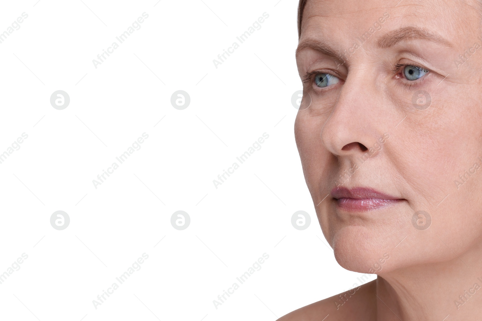 Photo of Senior woman with aging skin on white background, closeup. Rejuvenation treatment