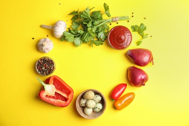 Photo of Frame of ingredients for cooking on yellow background, flat lay. Space for text