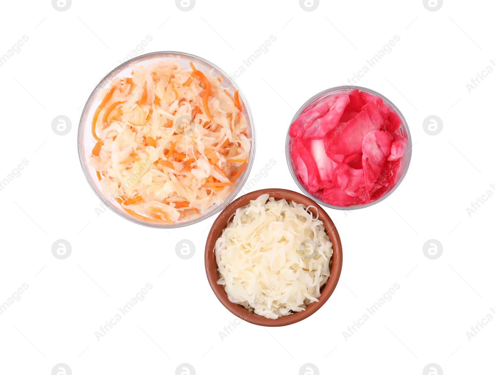 Photo of Delicious sauerkraut prepared according to different recipes on white background, top view