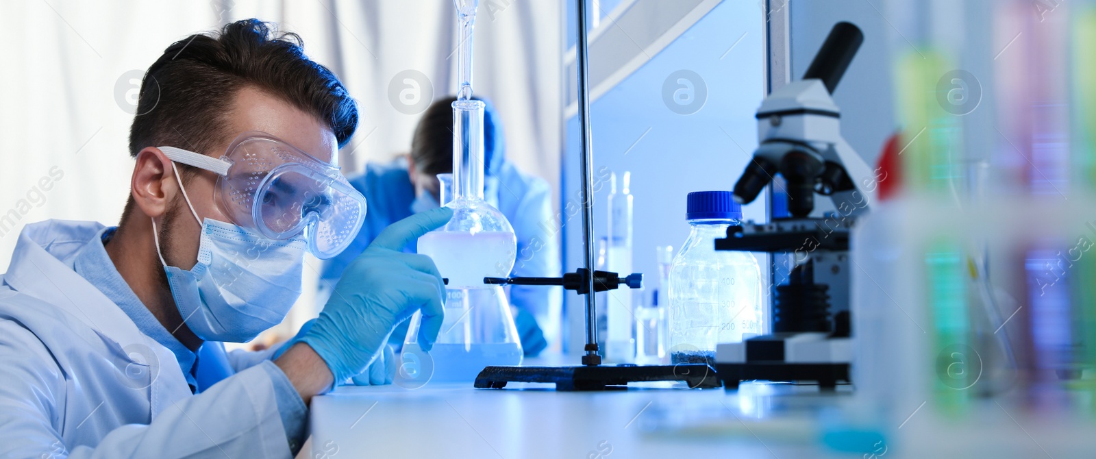 Image of Young scientist doing research and analysis in chemical laboratory. Banner design  