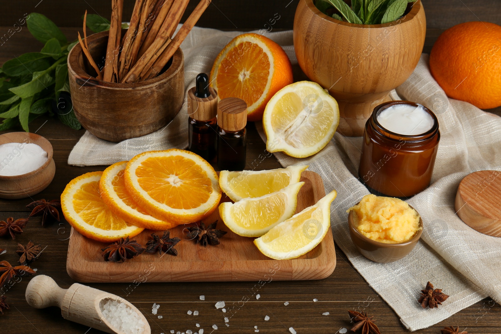 Photo of Homemade cosmetic products and fresh ingredients on wooden table