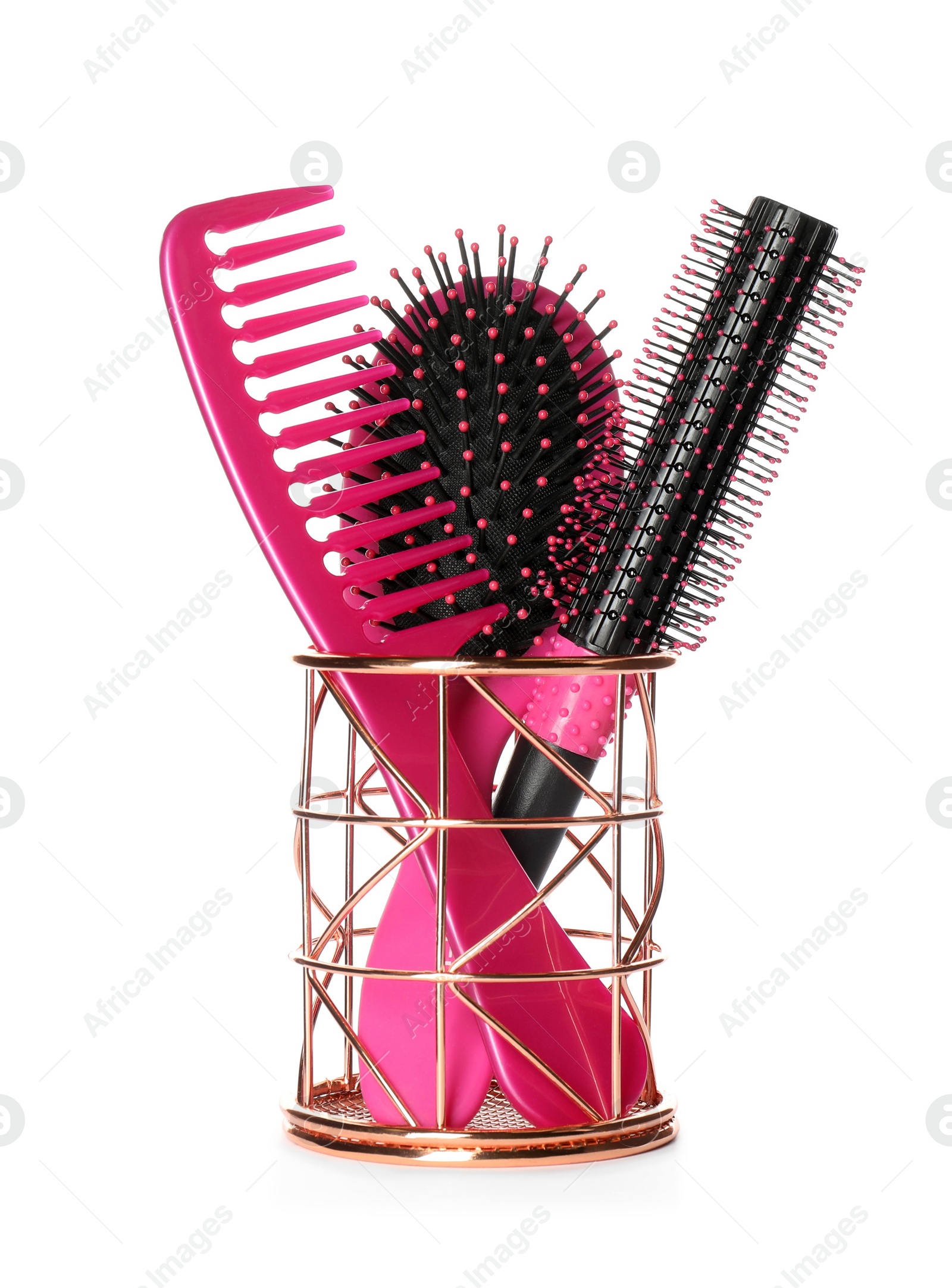 Photo of Hairbrushes and comb in holder on white background