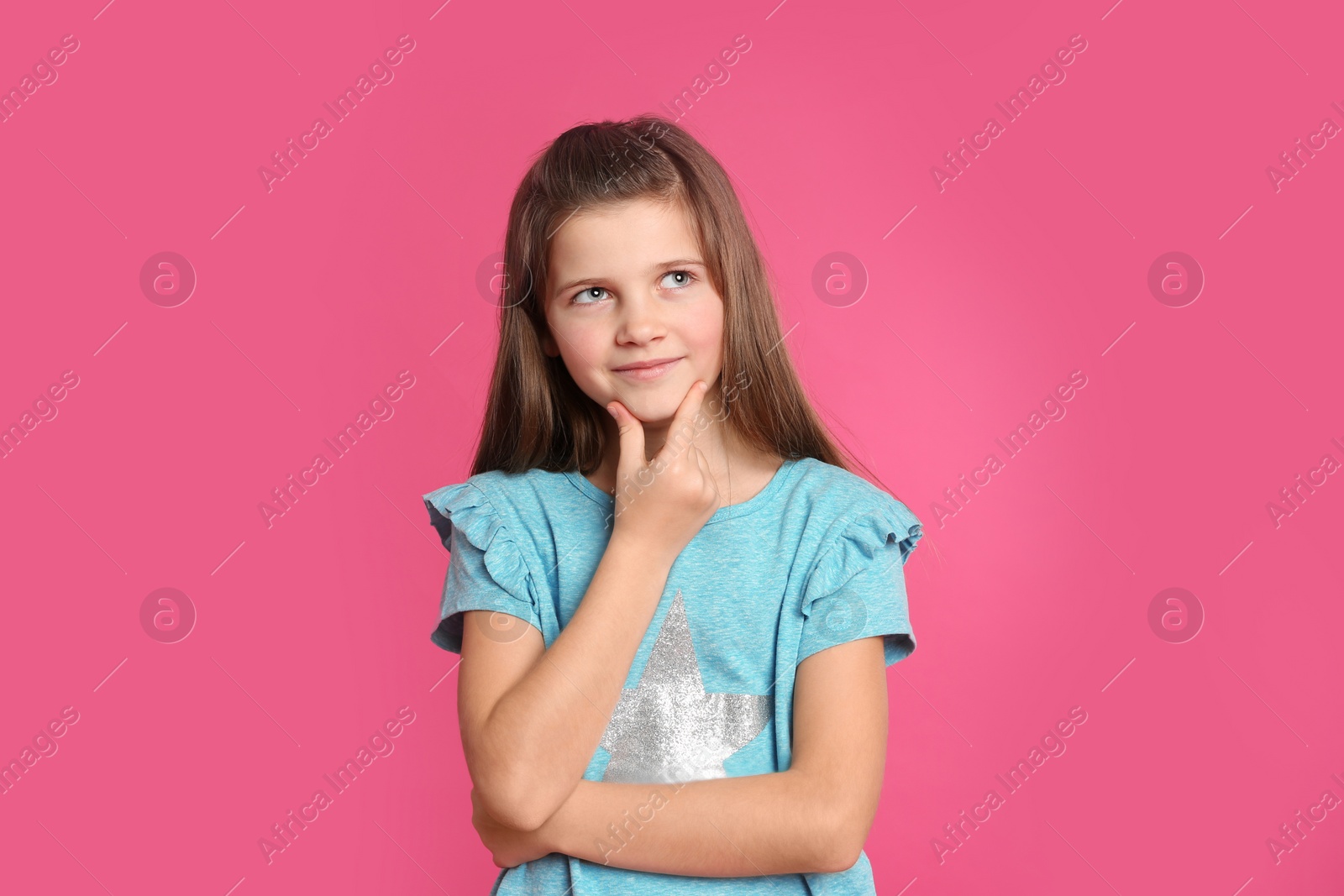 Photo of Portrait of preteen girl on pink background