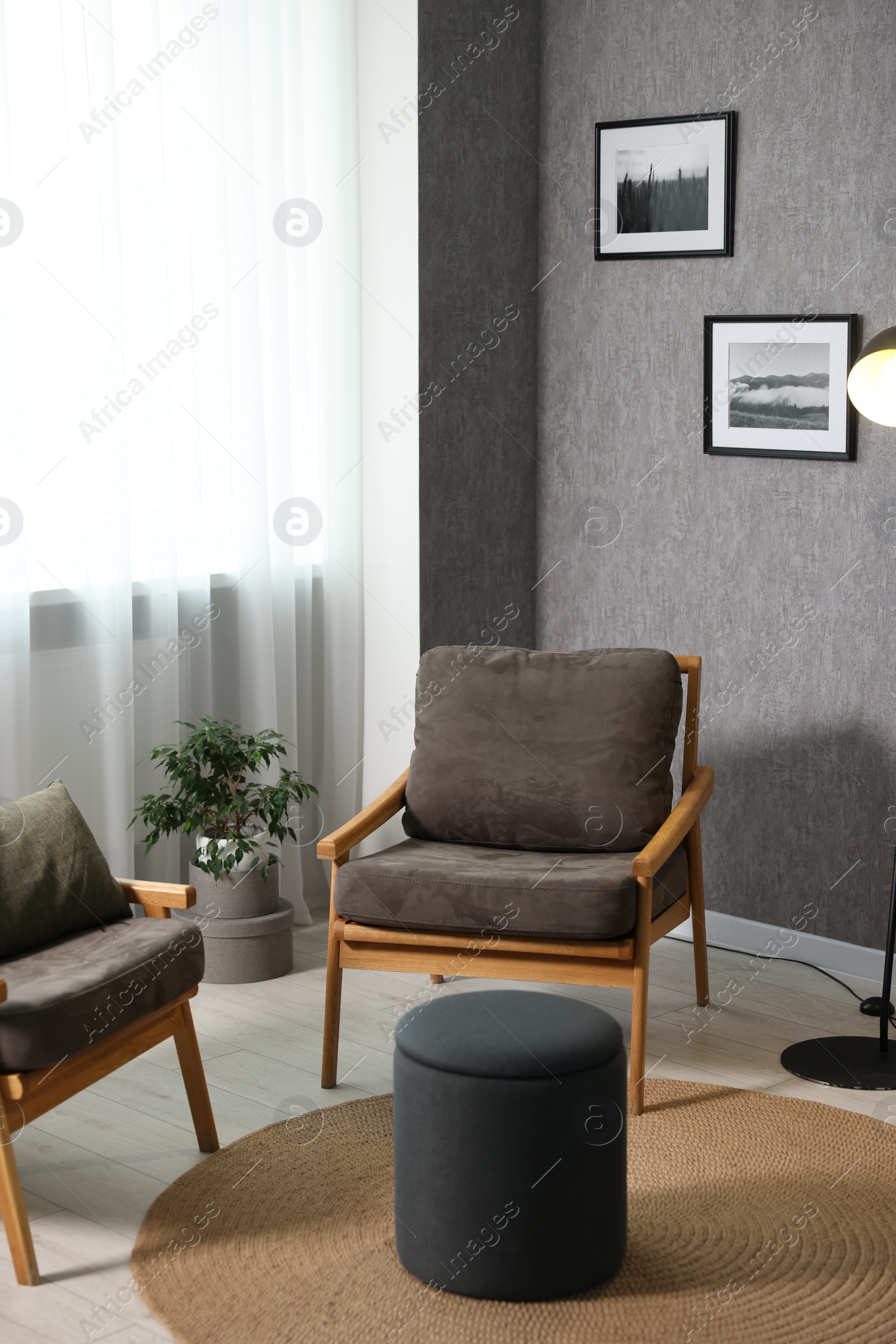 Photo of Home renovation. Room interior with stylish gray wallpaper on wall