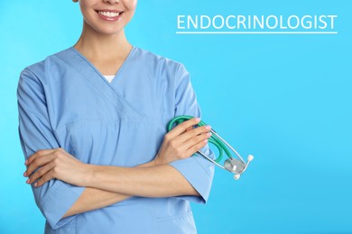 Endocrinologist with stethoscope on light blue background, closeup