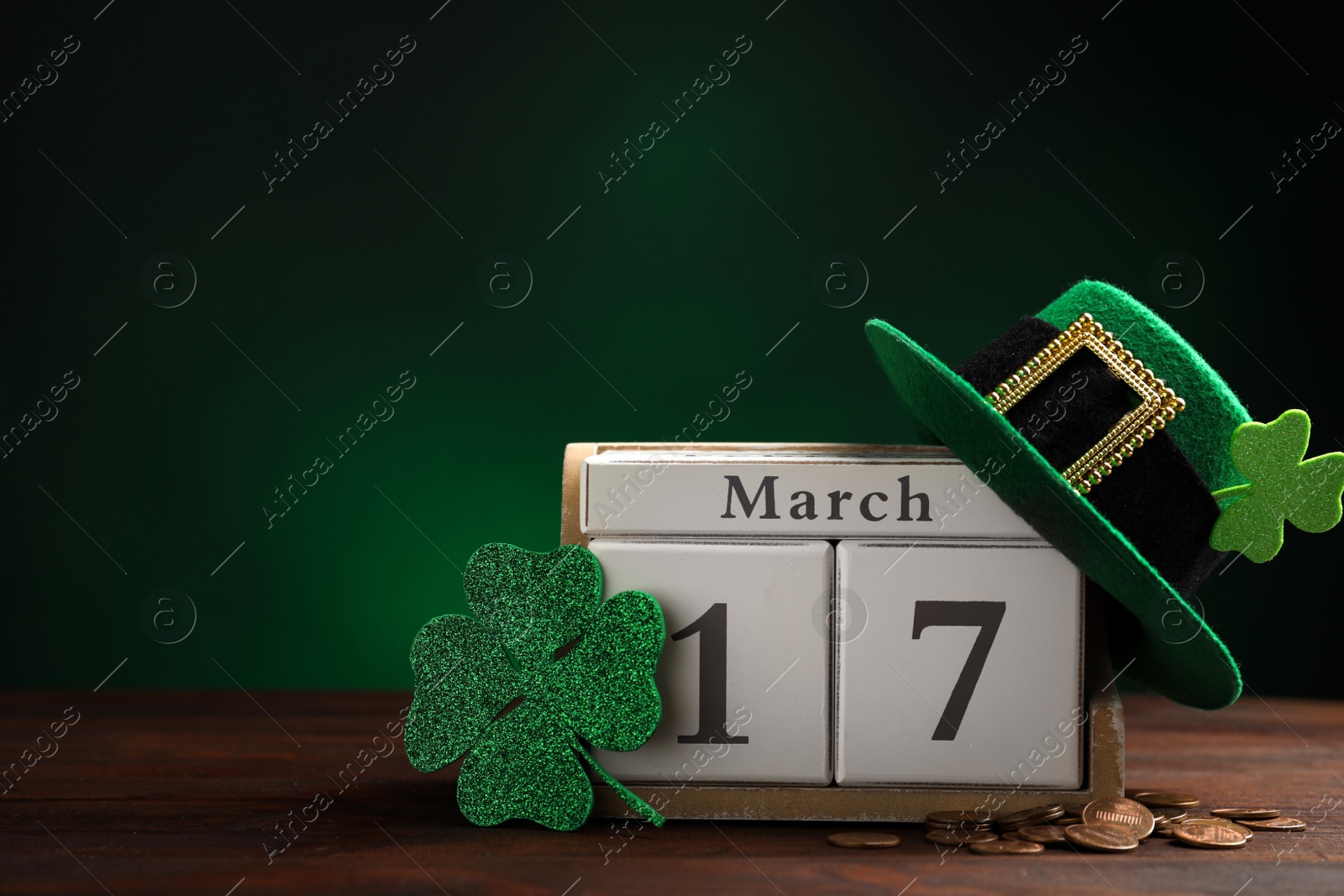 Photo of Composition with block calendar on wooden table, space for text. St. Patrick's Day celebration