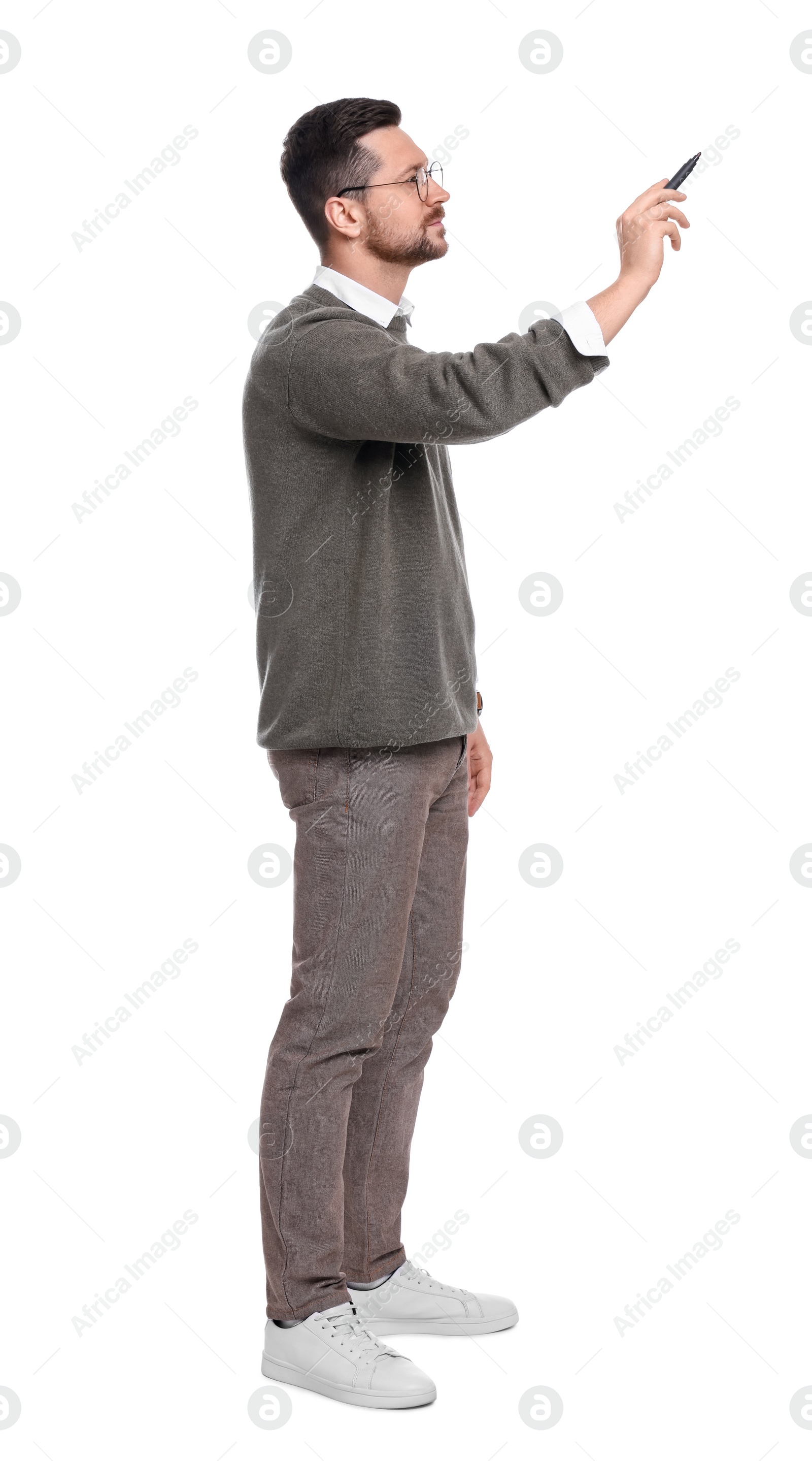 Photo of Handsome bearded businessman with marker on white background