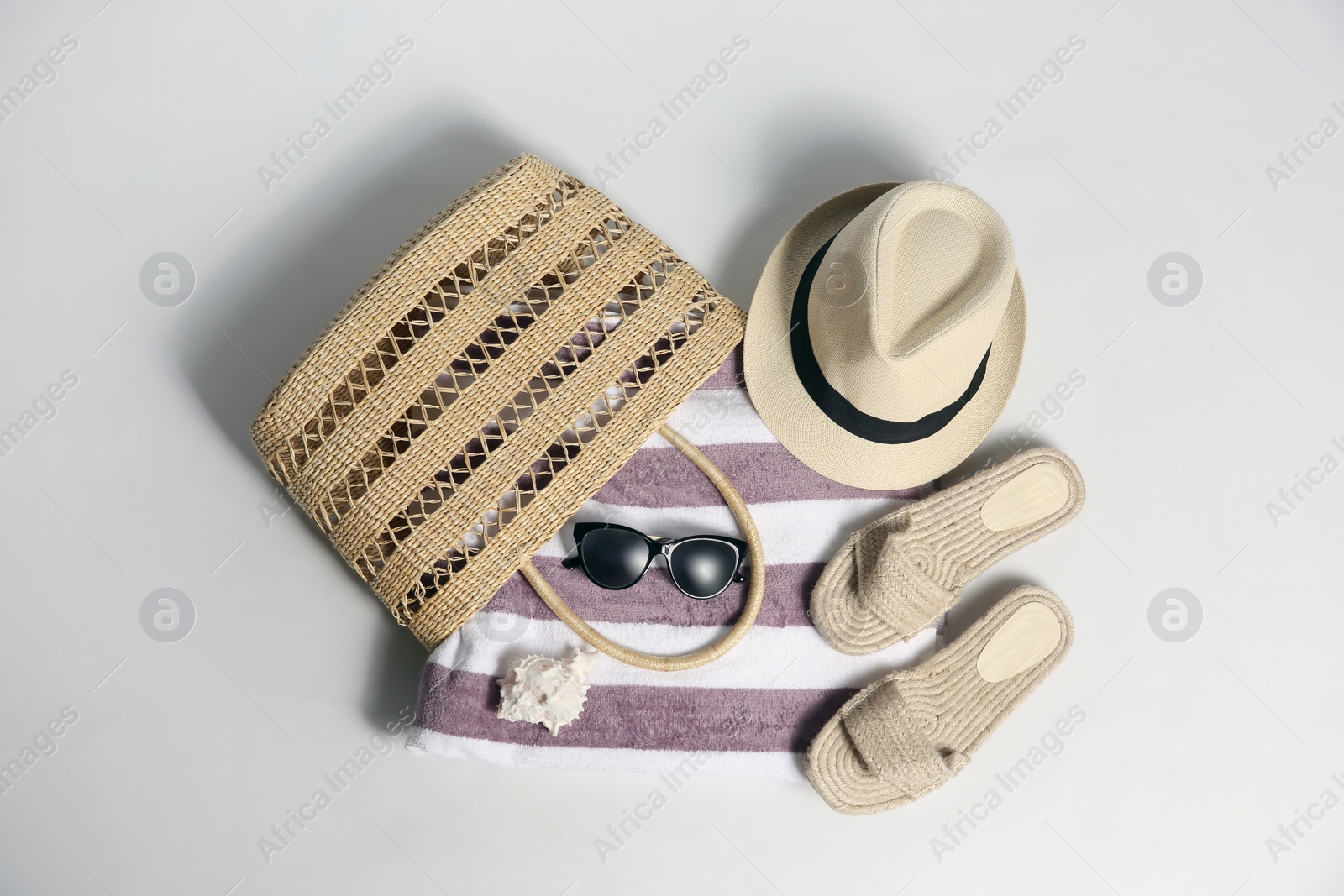 Photo of Composition with stylish beach accessories on white background, top view