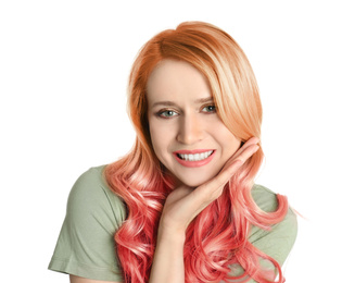 Portrait of young woman with dyed long curly hair on white background