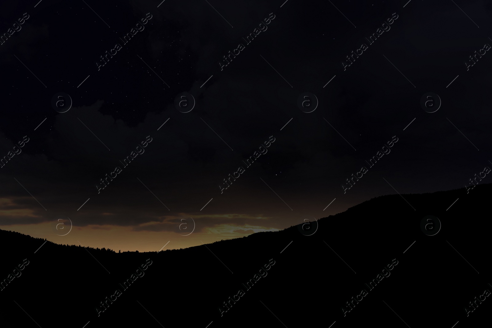 Image of Beautiful view of starry sky over mountains at night