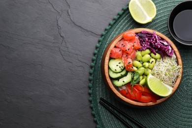 Photo of Delicious poke bowl with vegetables, fish and edamame beans on black table, flat lay. Space for text