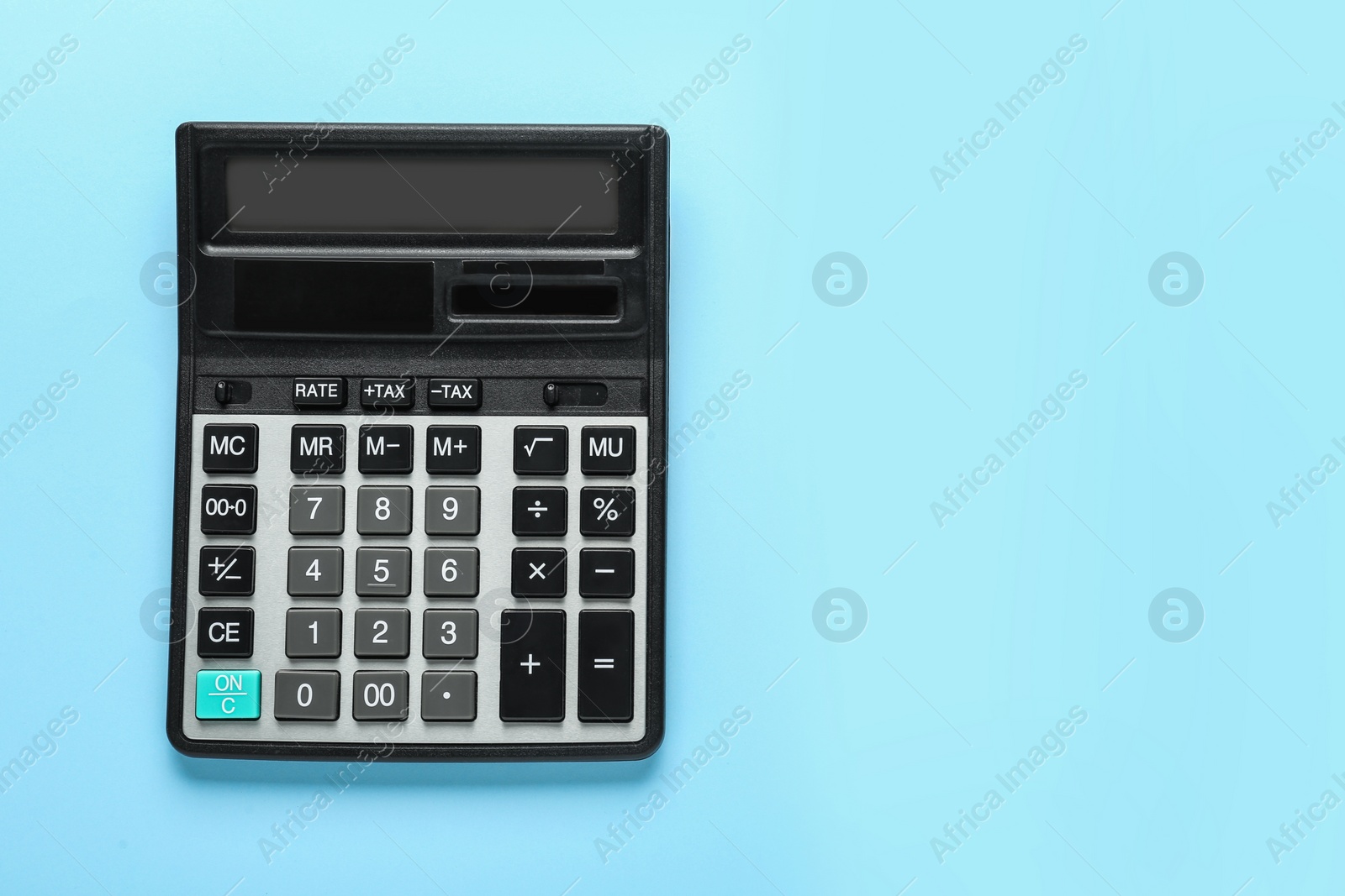 Photo of Modern calculator on turquoise background, top view. Space for text