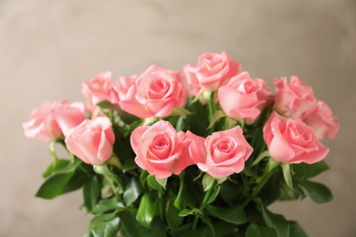 Bouquet of beautiful roses on blurred background