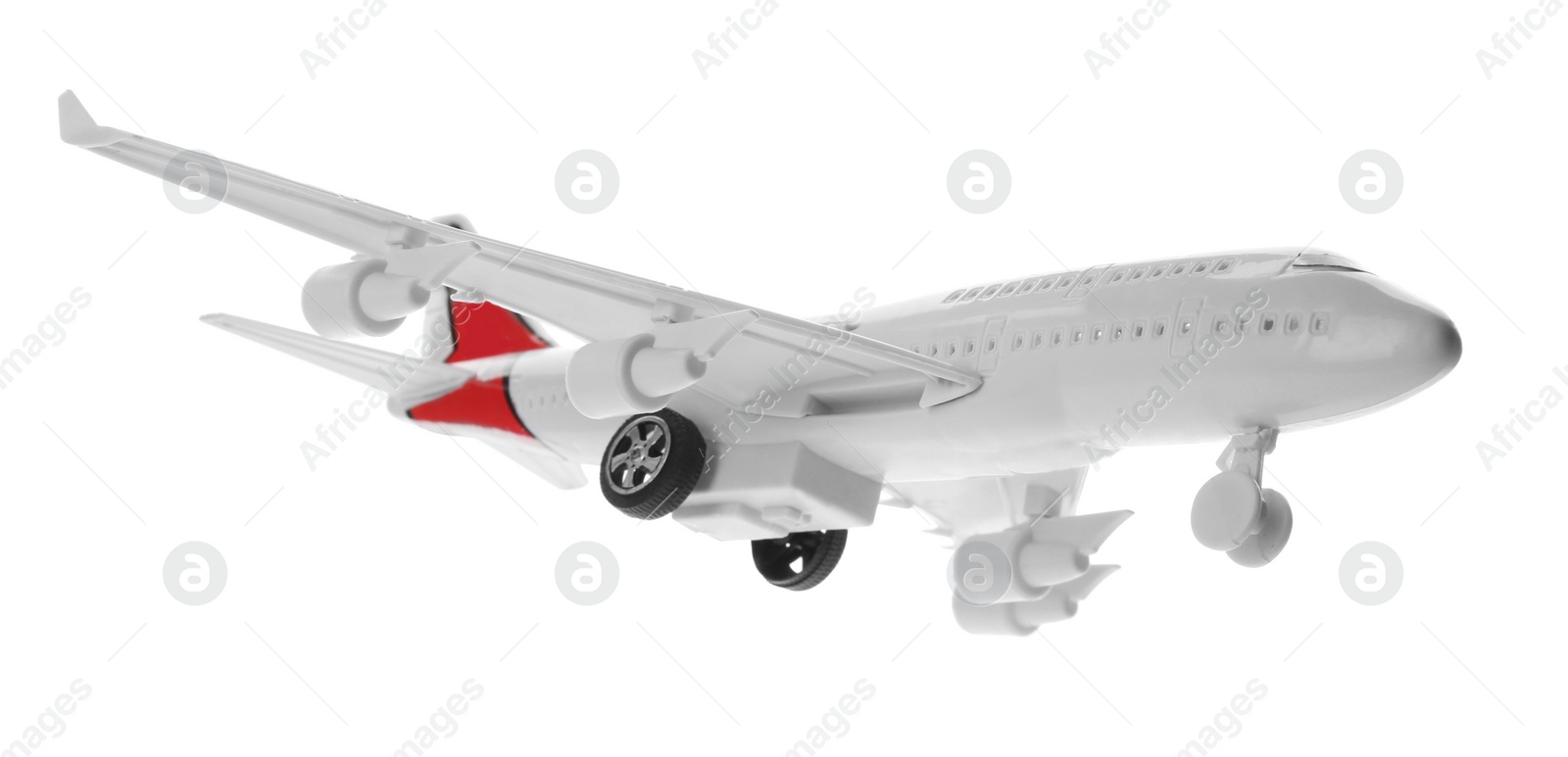 Photo of Toy airplane isolated on white. Travel concept