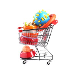 Photo of Different pet goods in shopping cart isolated on white. Shop items