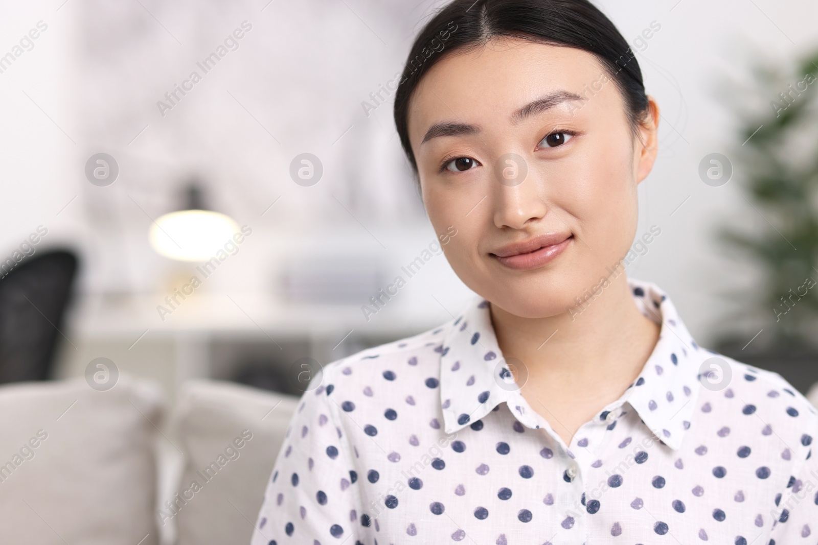 Photo of Portrait of beautiful businesswoman in office. Space for text